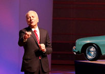Dr. Jim Doti presenting with car in background