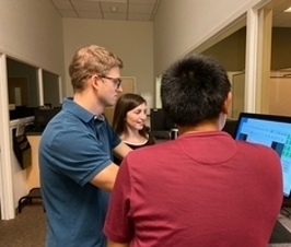 grad students in lab observation room
