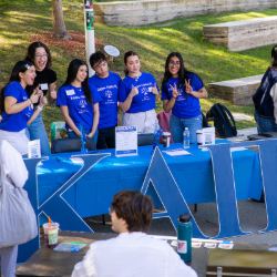 Students host table to promote their fraternity at involvement fair
