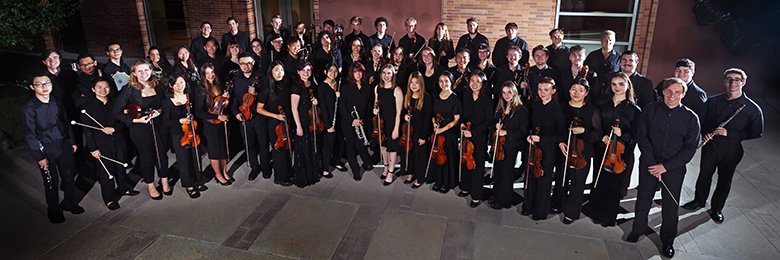 orchestra assembled in concert black on outdoor patio