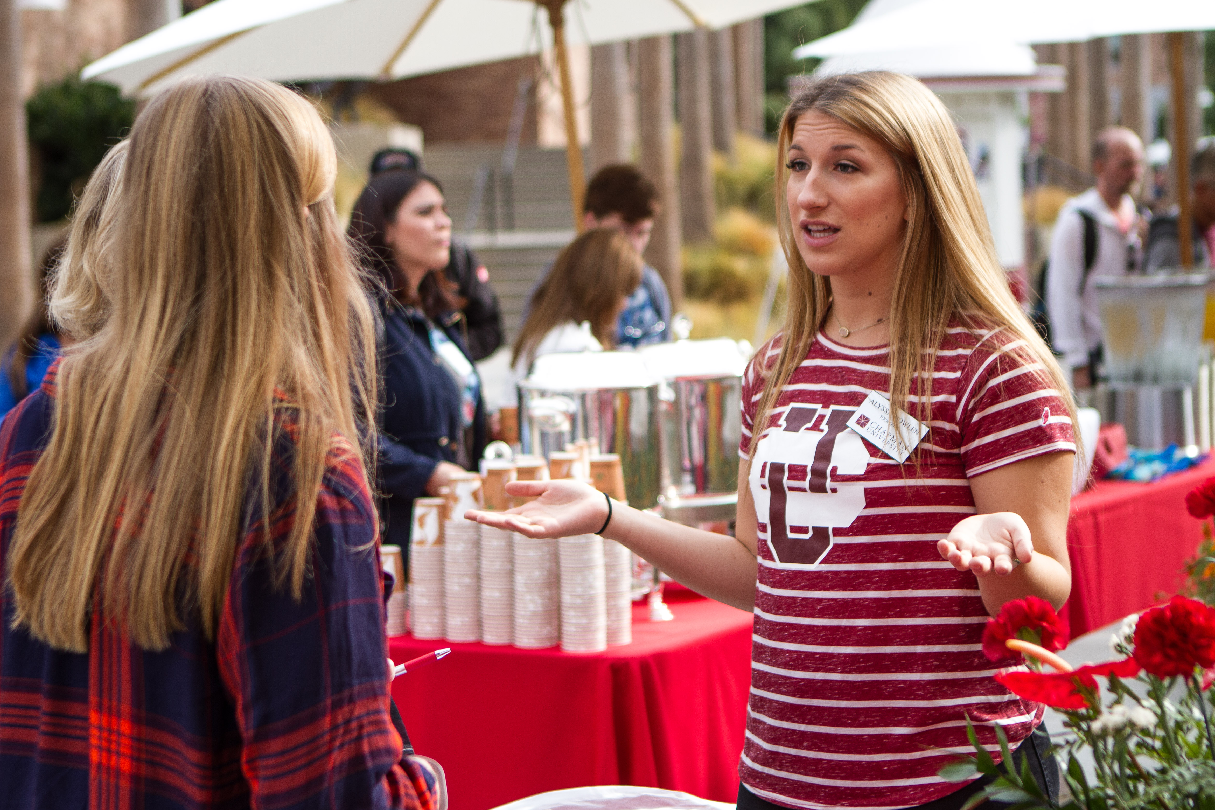 Student talking to visitor at Discover Chapman Day