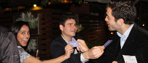 alumni exchanging business cards