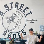 Emma Lam doing a double thumbs up at B Street Shoes