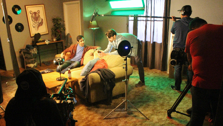Screen actors filming on set.
