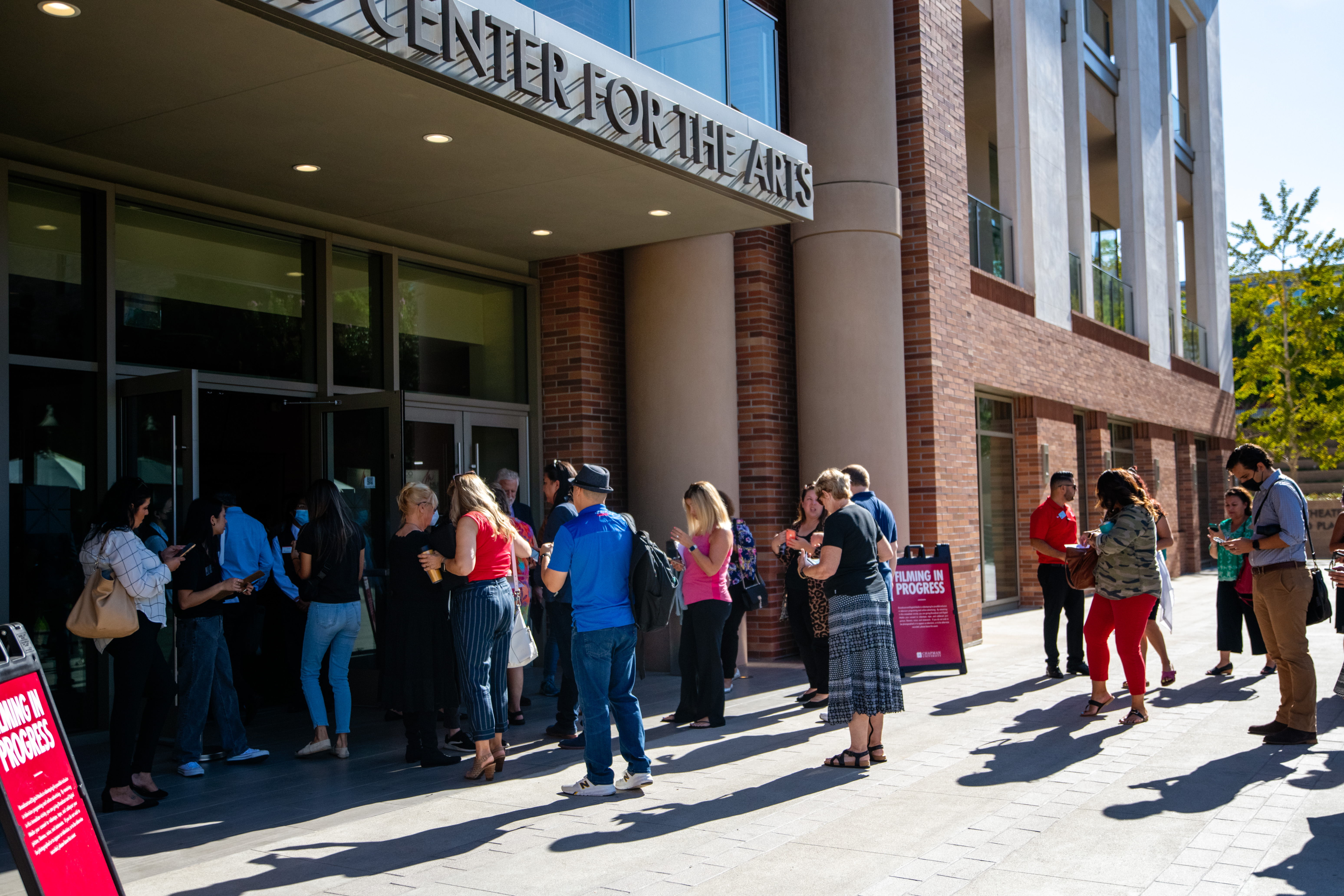 Summit attendees lining up outside Musco Center for the Arts.