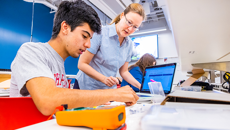 Student and Teacher in lab