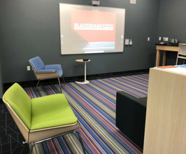 Colorful chairs and projector from Tech Hub