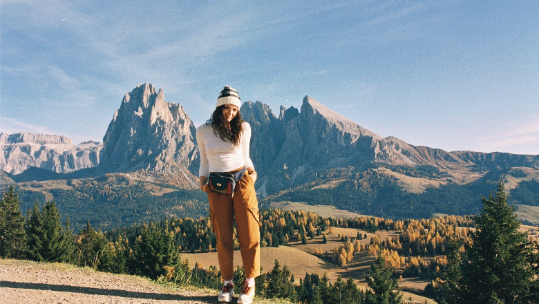 student in front of alps