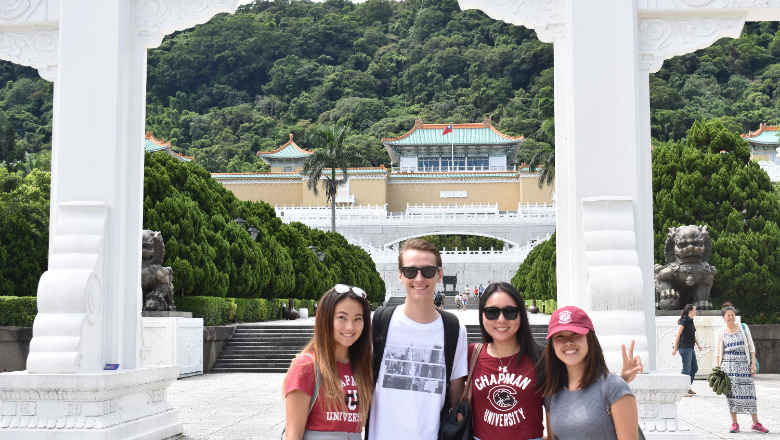 Students and teacher in front of museum steps in Taiwan