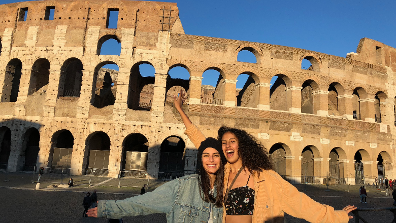 Two students in front of the Collesium in Rome