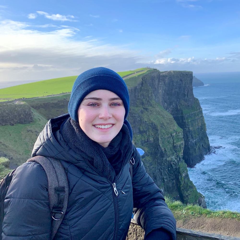 Student at the green Cliffs of Moher