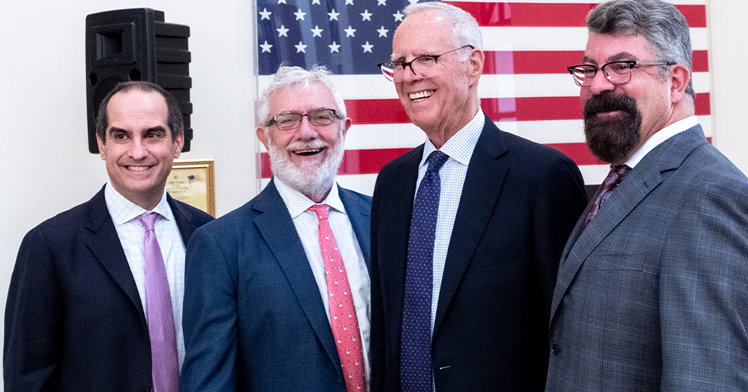 Photograph of (from left) Chapman’s Chief Advancement Officer Matt Parlow, Chapman President Daniele C. Struppa, Chapman Board of Trustees Chair Parker S. Kennedy, and Dean of Fowler School of Law Paul D. Paton, KC 