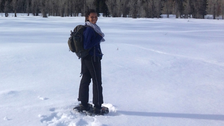 Chapman student walking through snow