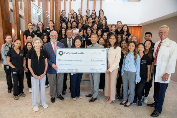 PA program students receiving check from Cal Optima