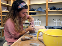 Student working clay