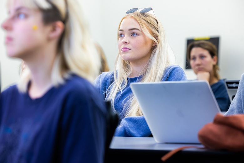 Wilkinson College student listening intently to lecturer